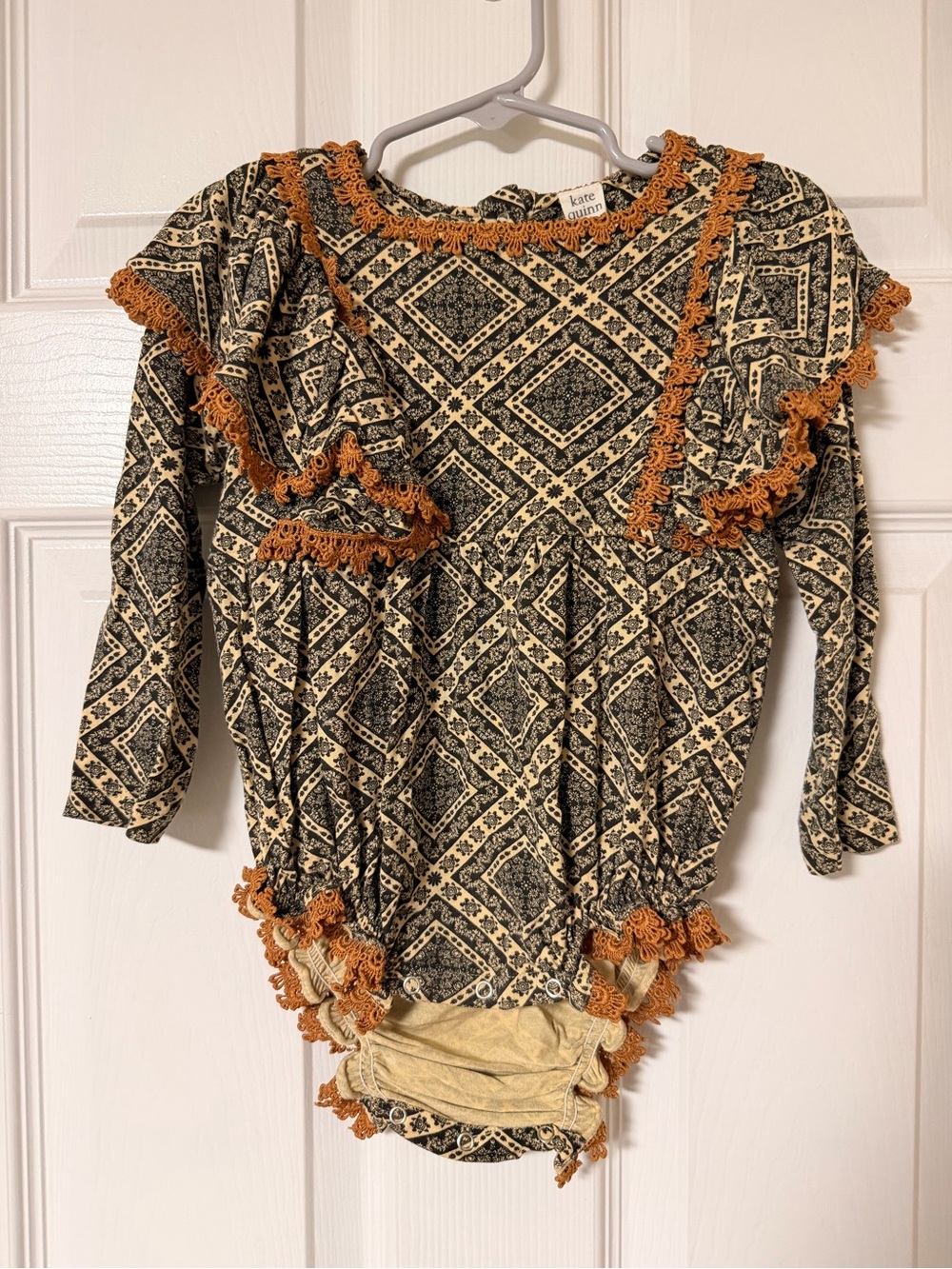 Kate Quinn Bamboo Black Diamond Print Ruffle Snap Bodysuit with Rust Trim
